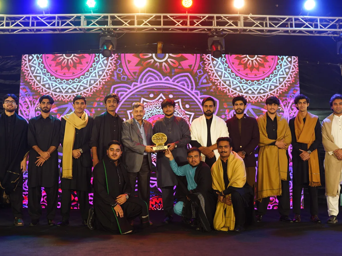 Student leaders and campus staff posing with an award.